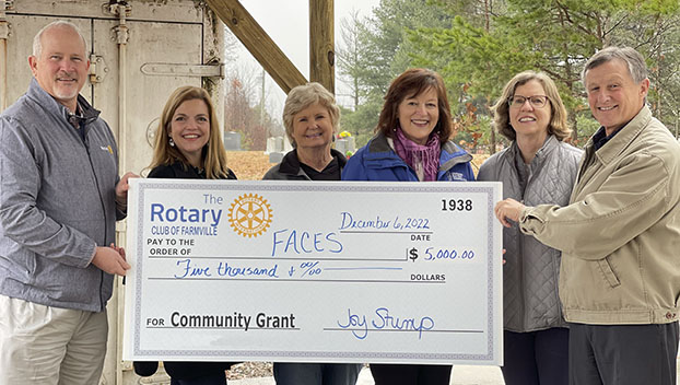 Presentation of check to Faces